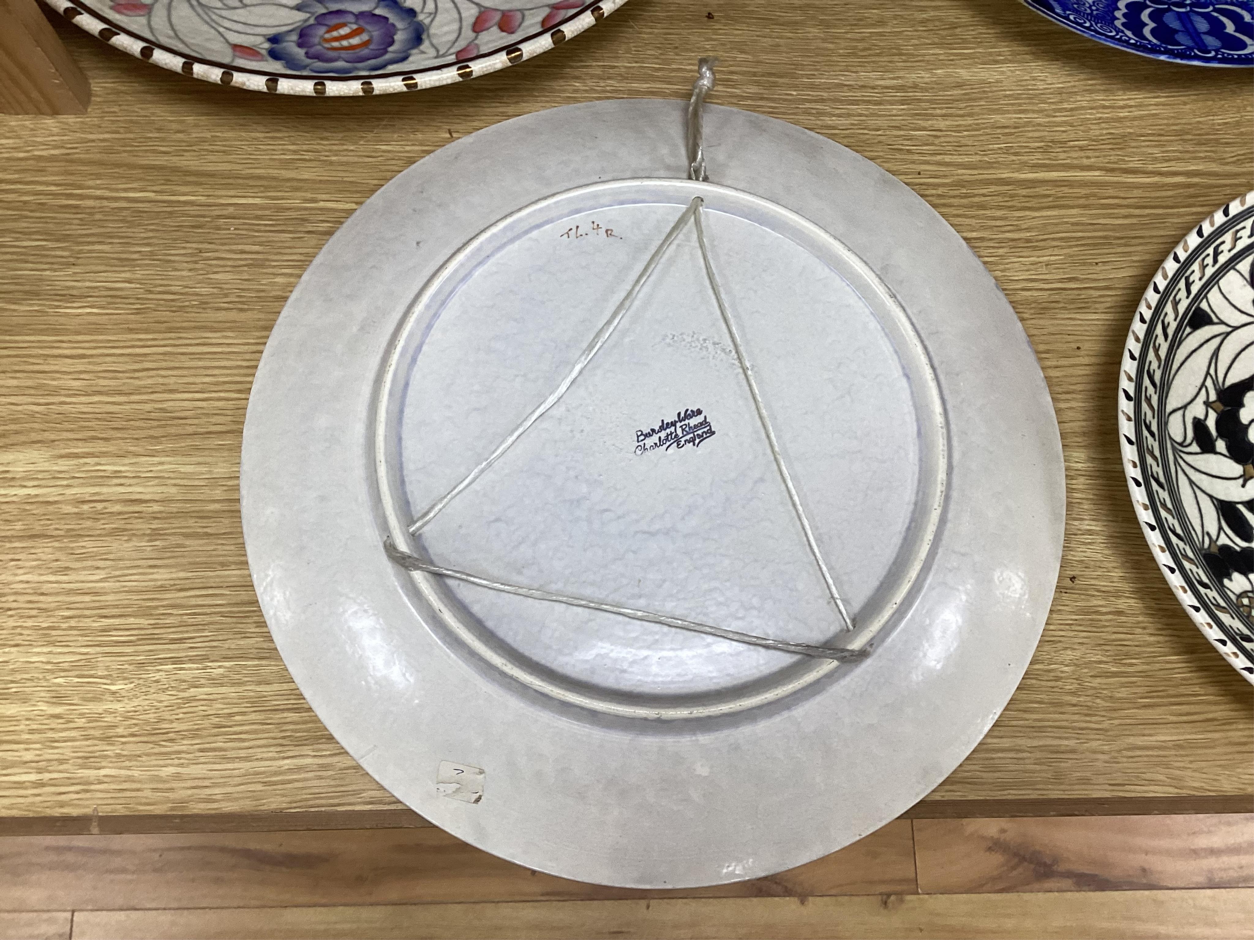 Two Charlotte Rhead signed chargers, a similar signed matching plate and vase and a ‘Mikado’ Burslem blue and white Oriental style charger designed by Frederick Rhead, largest 45cm diameter. Condition - good